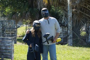Father and daughter in paintball gear